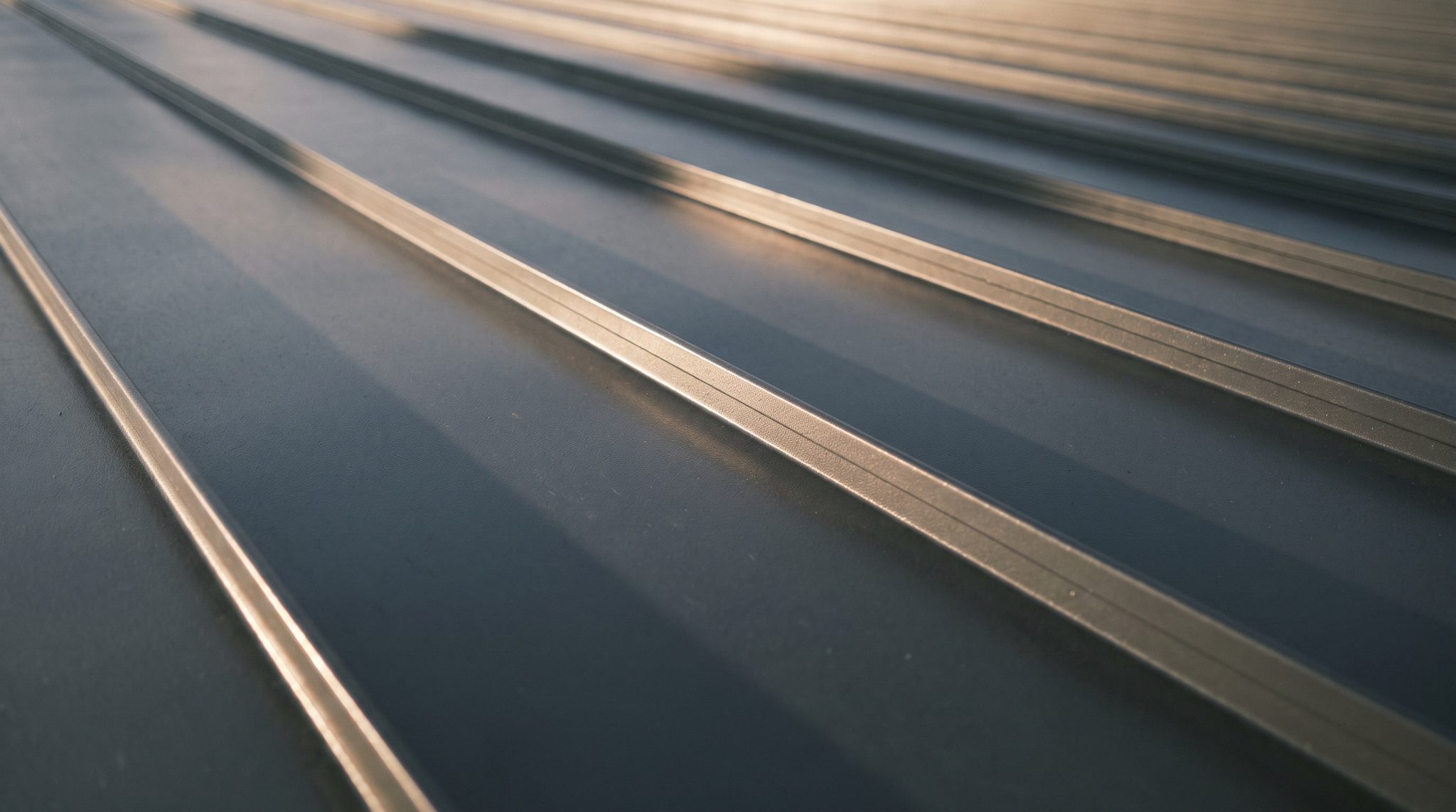 Close-up of a grey standing seam metal roof